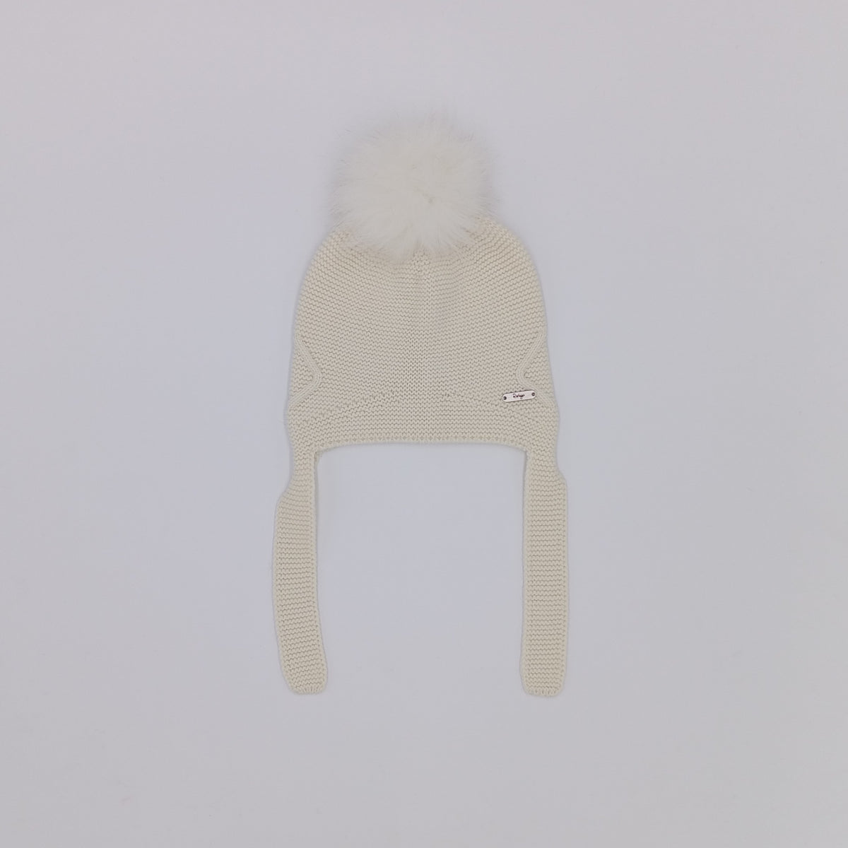 Rahigo cream knitted hat with ear flaps, tie fastening and real fur pom pom, made in Spain.