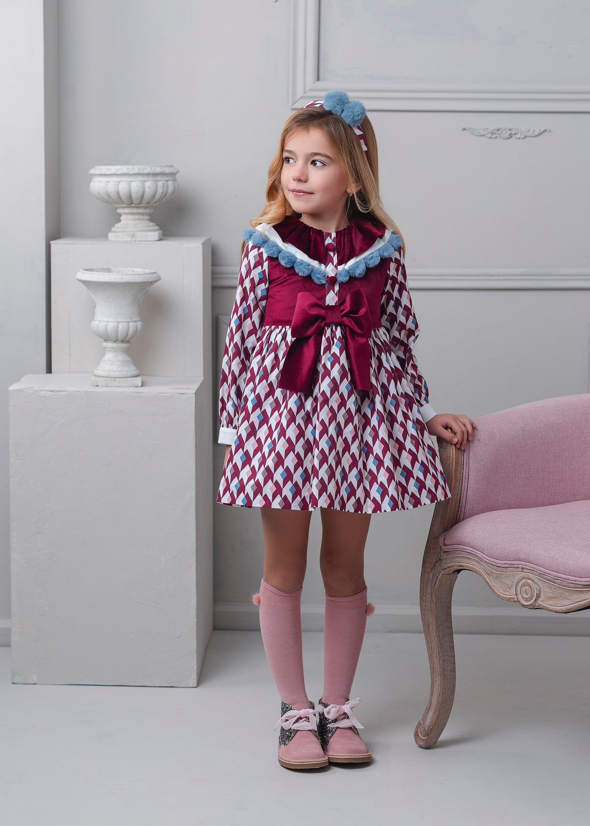 Rochy Rombo girls burgundy dress 26759 with geometric print, statement burgundy bow and blue trim