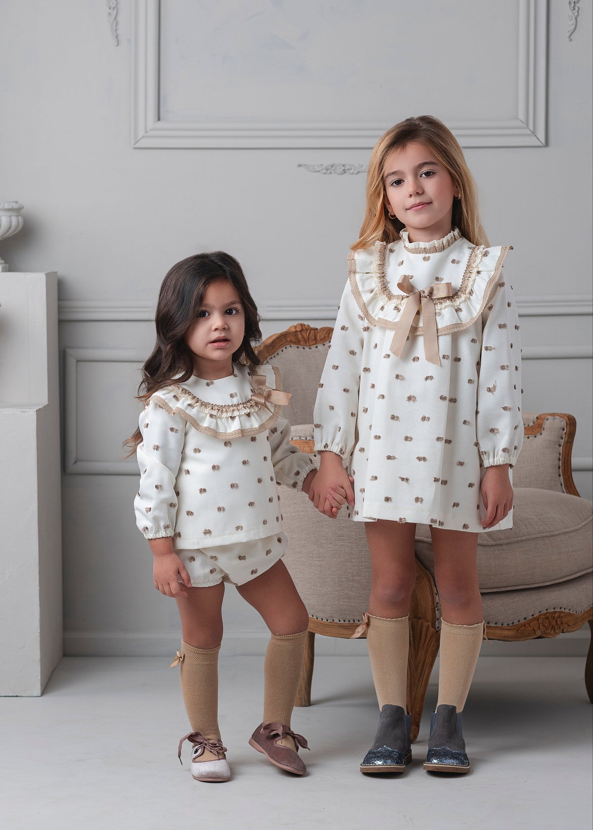 Rochy Motas girls camel polka dot A-line dress 26766 with cream fabric, ruffle bib and camel bow