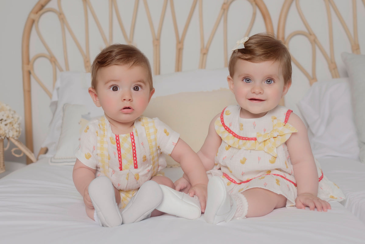 Miranda Little Chick girls lemon cotton muslin dress with chick print, gingham frill and bow And matching boys short set