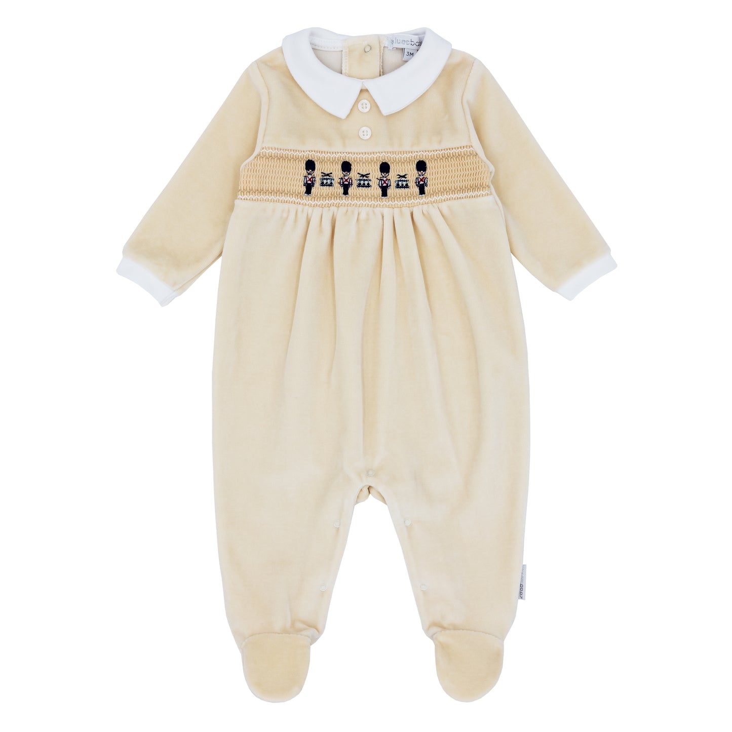 Blues Baby Silves boys beige cotton velour babygrow with smocked soldier and drum embroidery and white collar