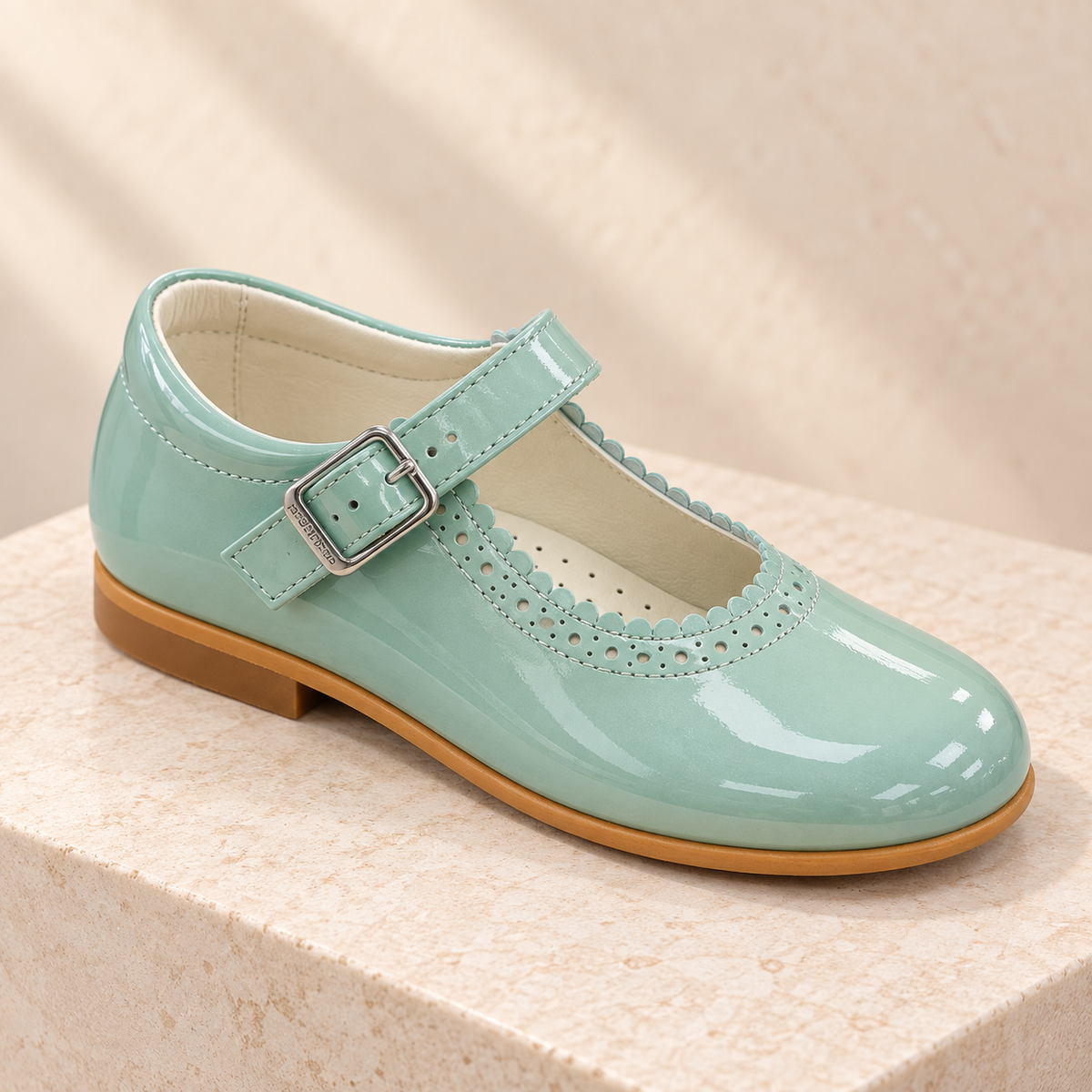 Andanines green pearl patent leather girls Mary Jane shoes with scalloped perforated detail and buckle strap