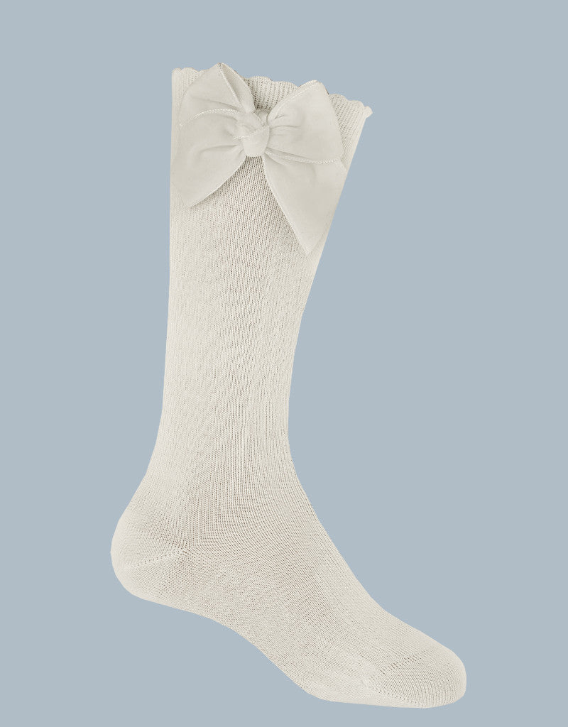 cream knee-high socks for girls with velvet bow detail by JC Castella