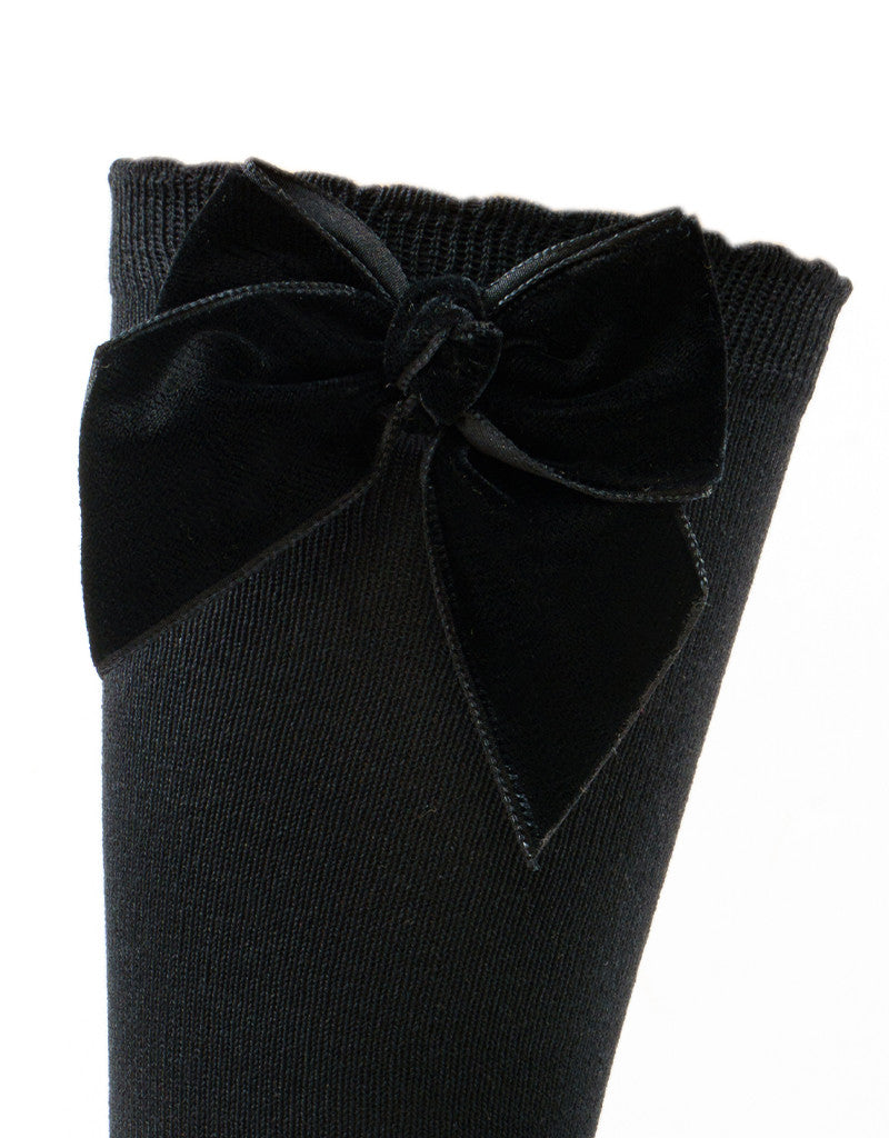 black knee-high socks for girls with velvet bow detail by JC Castella