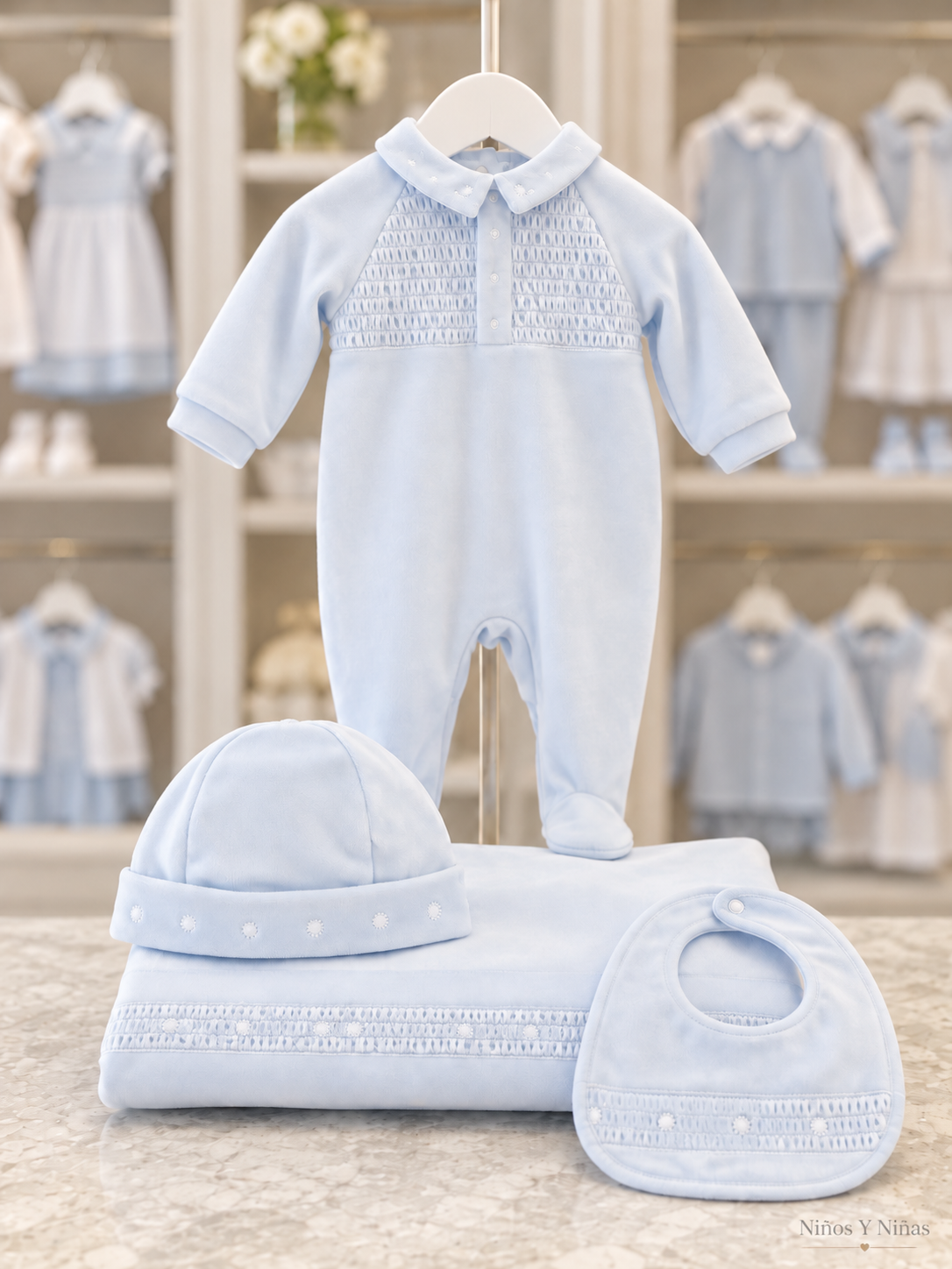 Deolinda Fantasy pale blue velour smocked bib with matching babygrow, hat and blanket