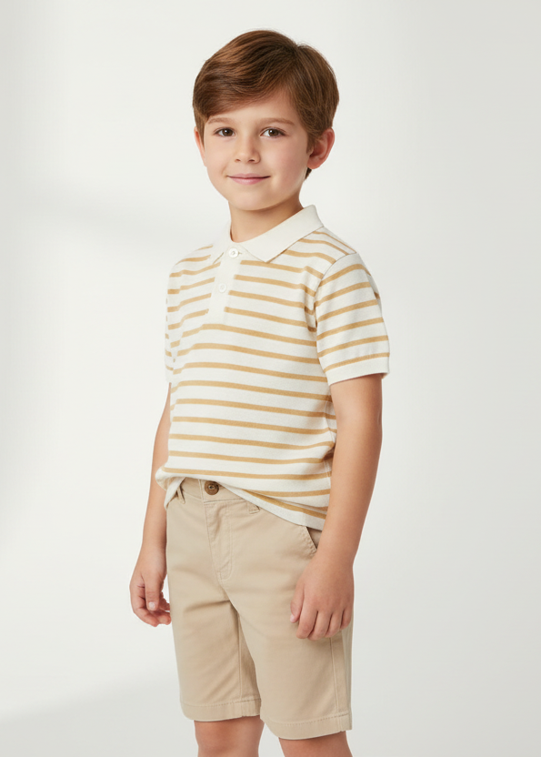 Boy wearing the Mayoral beige striped knitted polo top and chino shorts