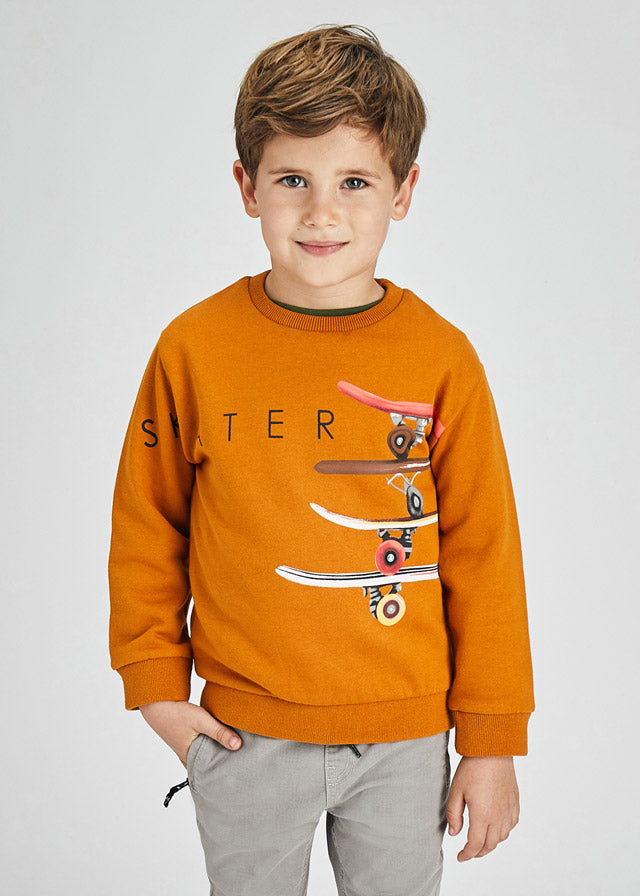 Boy wearing Mayoral mustard skater sweatshirt 4402 with grey trousers
