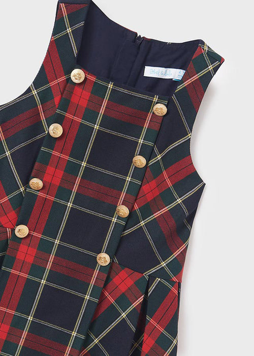 Girl wearing Abel & Lula navy tartan pinafore dress
