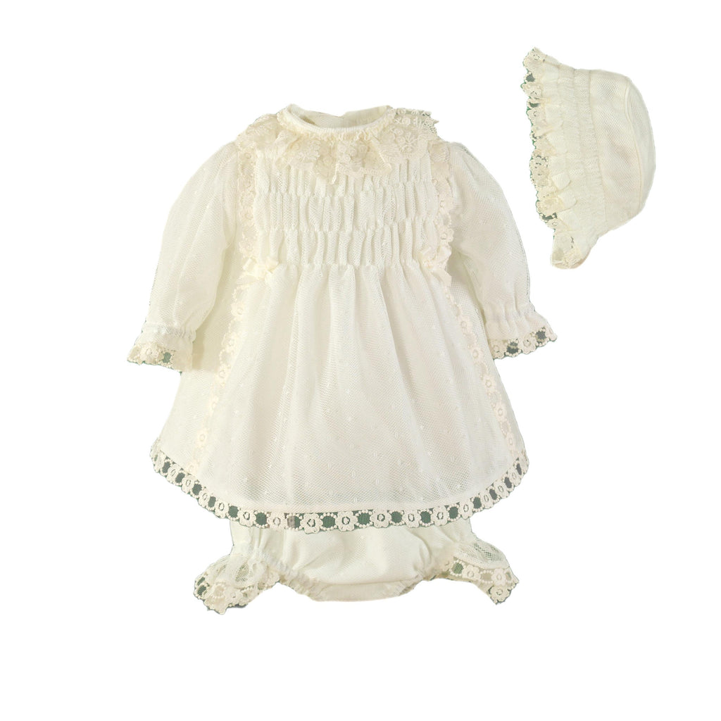 Miranda Ceremonia cream girls dress with bonnet and knickers featuring tulle overlay, ruched bodice and lace trim