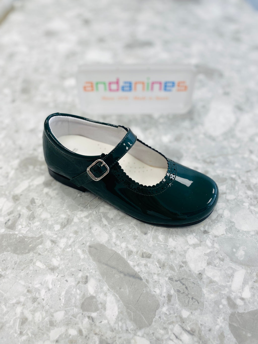 Andanines bottle green patent leather girls Mary Jane shoes with adjustable buckle fastening, handcrafted in Spain