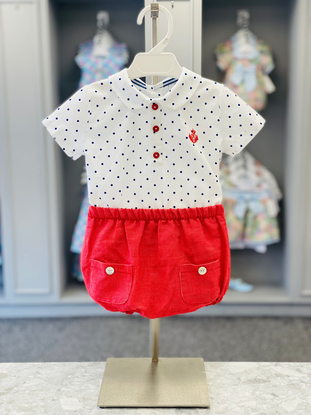 Rochy Azulejo baby boys blue polka dot top and red jam pant set - up close