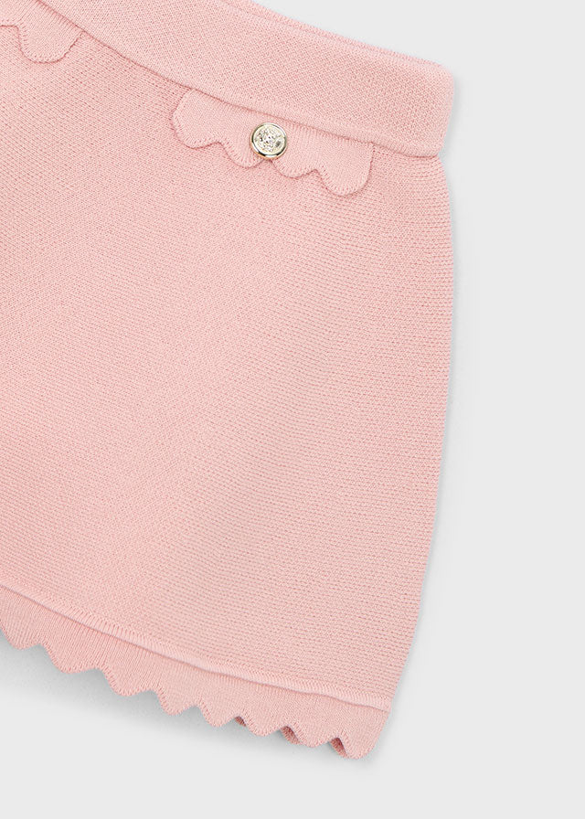 Mayoral blush pink knitted girls skirt with scalloped trim and decorative button detail