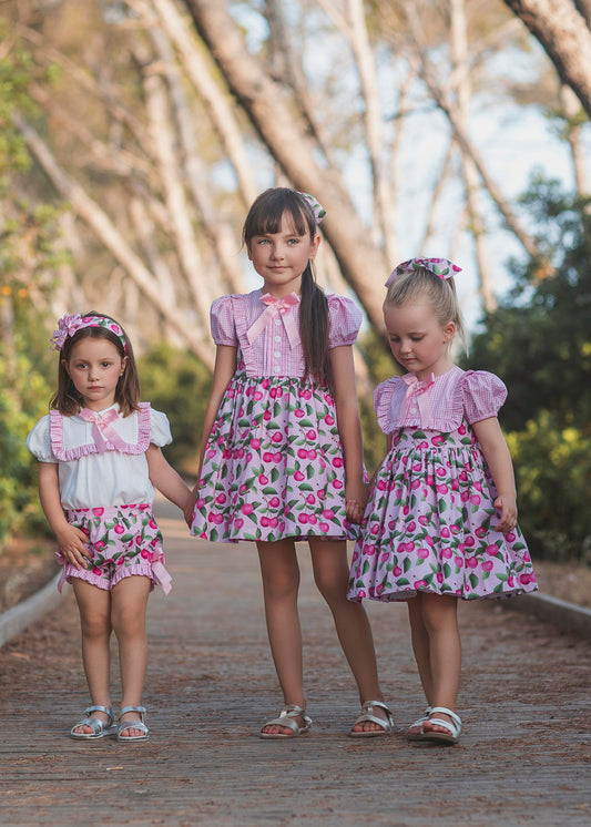 Rochy Cherry girls pink dress 26801 with gingham bodice, puff sleeves and cherry print skirt