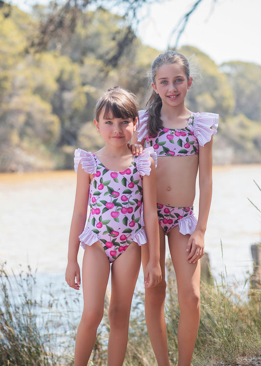 Rochy Cherry girls pink swimsuit 26915 with cherry print and pink gingham ruffle detailing