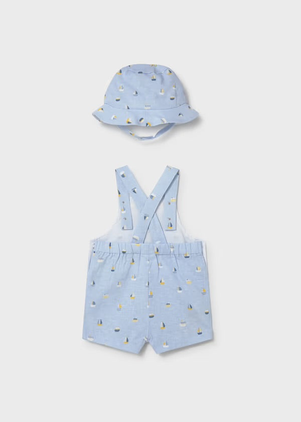 Close-up of the Mayoral dungaree straps, wooden-effect buttons and boat print