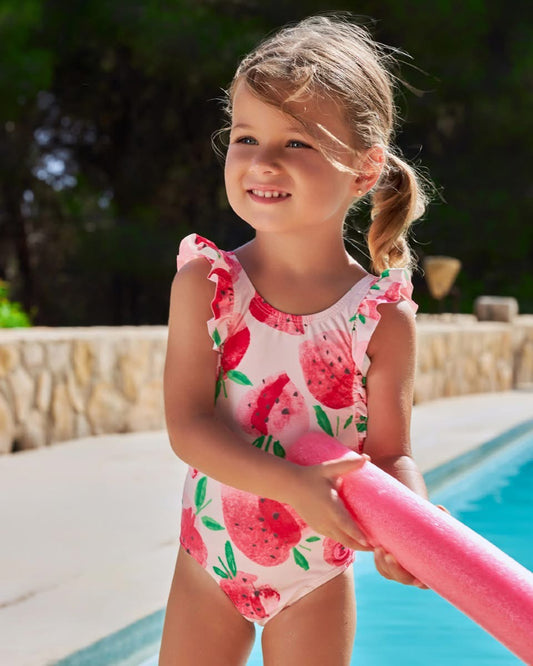 Little girl wearing Tutto Piccolo Costa Rica Girls Pink Strawberry Print Swimsuit