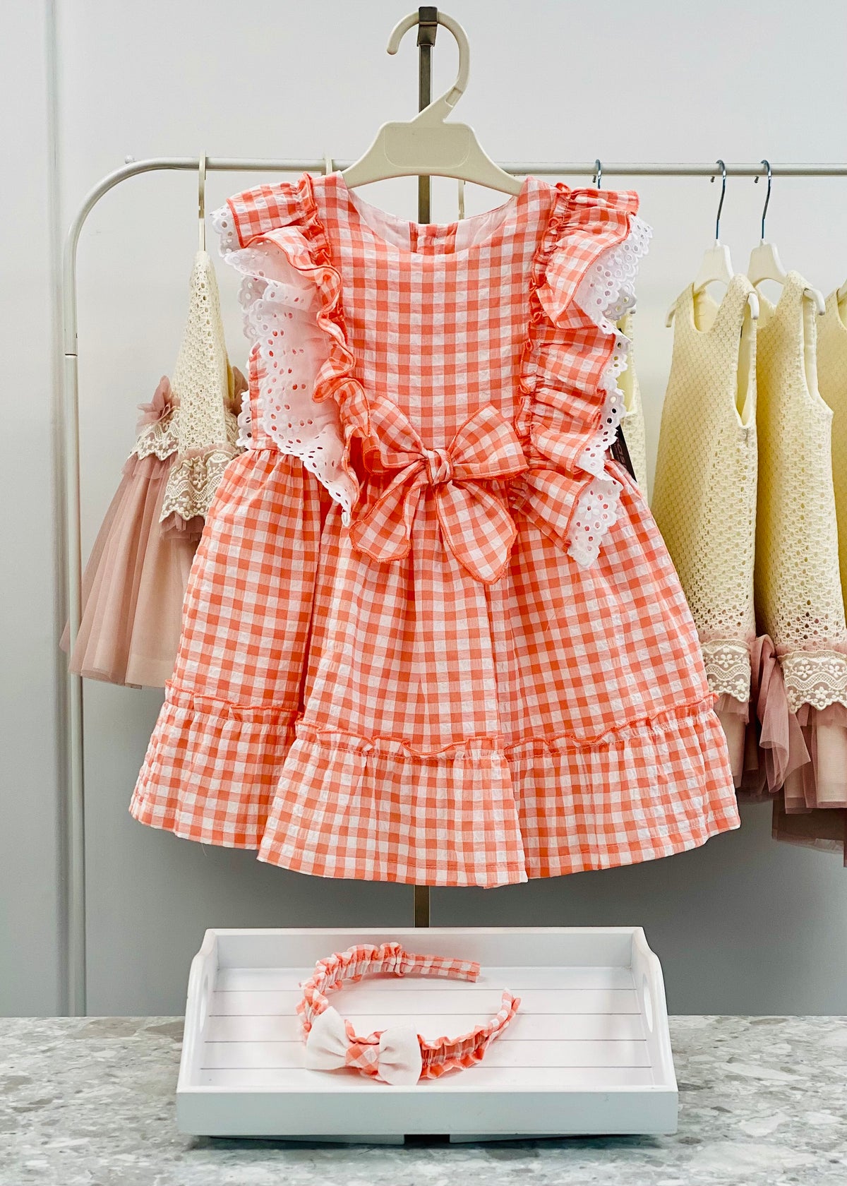 Basmarti Lola coral gingham girls dress with broderie anglaise frill and bow