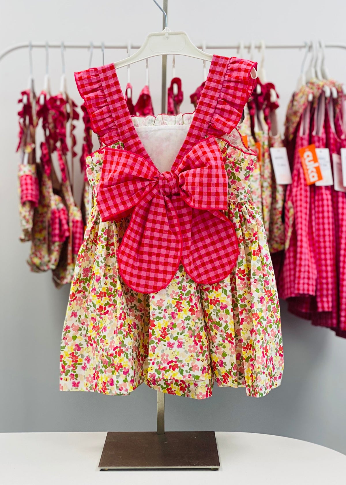 Cuka Flores girls floral dress with gingham trim and back bow