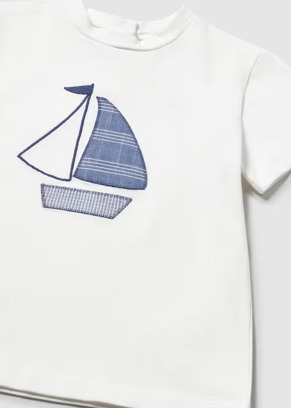 Close-up of the navy and blue sailboat motif on the Mayoral T-shirt