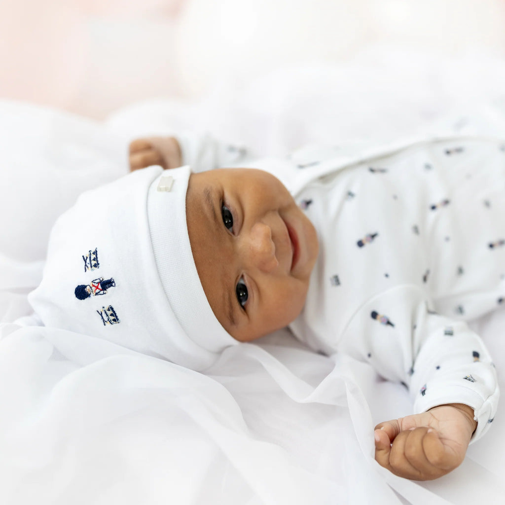 Blues Baby Sitges boys white cotton soldier print babygrow with matching embroidered hat - lifestyle