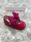 Andanines fuchsia pink patent leather girls shoes with detachable chiffon bow and adjustable Velcro fastening, handcrafted in Spain