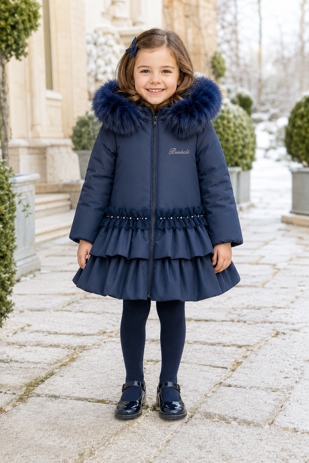 Bimbalo girls navy padded winter coat with fur hood pearl trim and statement back bow - front view