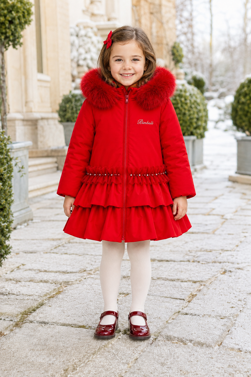 Bimbalo girls red padded winter coat with detachable fur hood pearl trim and statement back bow - front view