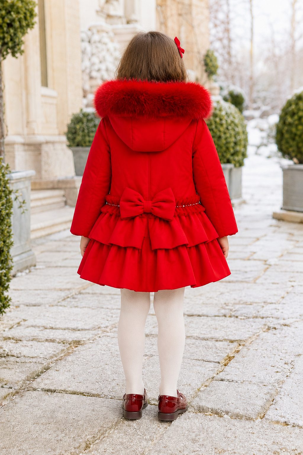 Bimbalo girls red padded winter coat with detachable fur hood pearl trim and statement back bow - back view