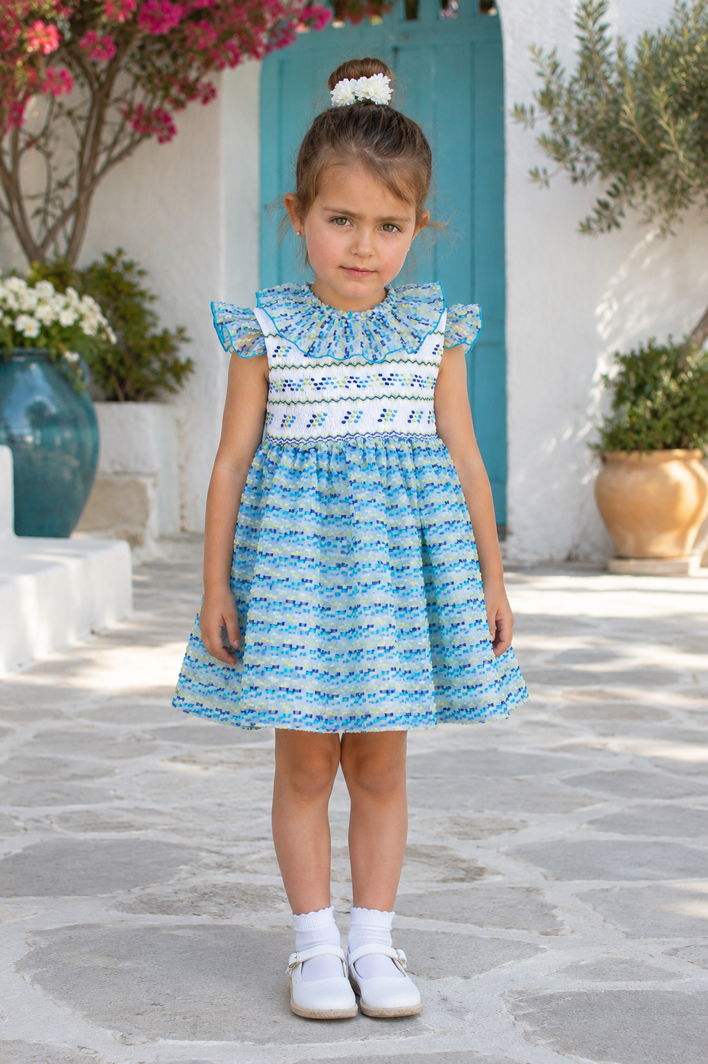 Front view of Naxos Marisol Girls Blue & Yellow Hand Smocked Dress