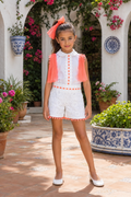 Naxos Neon girls white broderie anglaise short set with neon orange tulle bows and pom pom trim.