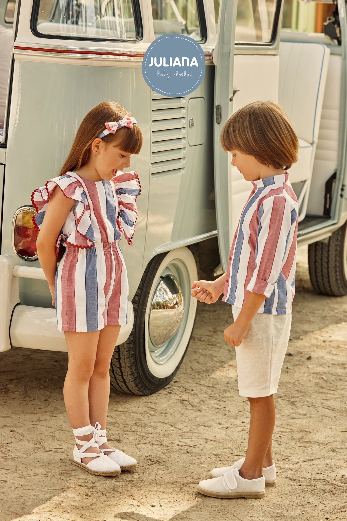 Girl in the Juliana Sandia striped ruffle playsuit with a coordinating boys outfit