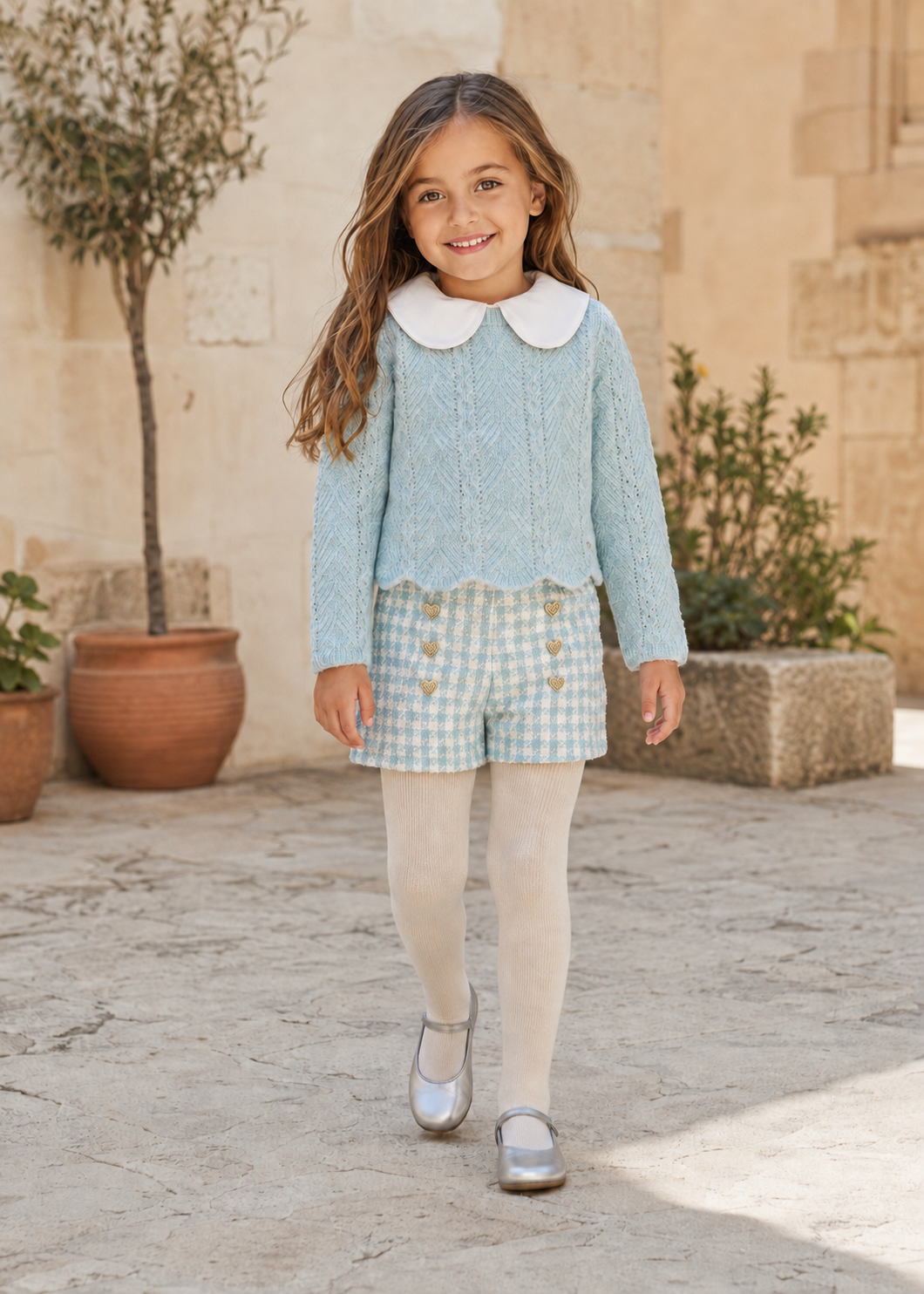 Girl in Spain wearing the Abel & Lula aqua tweed short set and jumper - 5829