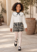 Girl in Spain wearing the Abel & Lula black dogtooth short set - 5612/5716