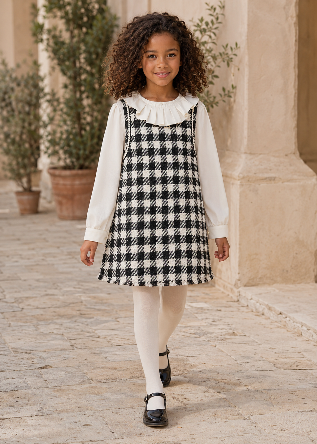 Girl in Spain wearing the Abel & Lula black tweed A-line dress - 5526