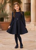 Girl wearing the Abel & Lula navy boucle jacquard occasion dress - 5535