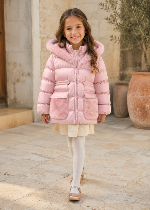 Girl in Spain wearing the Abel & Lula petal pink satin padded coat - 5849