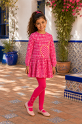 Spanish girl wearing the Agatha Ruiz de la Prada fuchsia check dress and matching tights