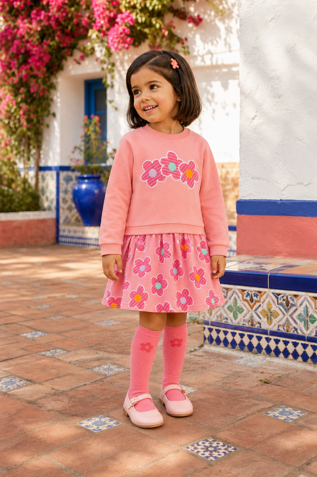 Spanish girl wearing the Agatha Ruiz de la Prada pink flower dress and matching knee-high socks