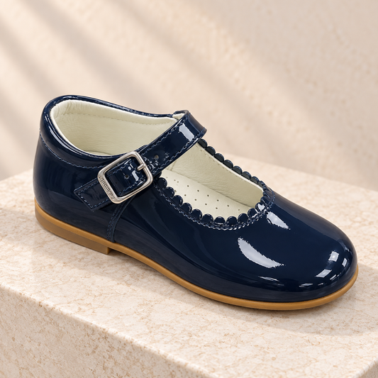 Andanines navy patent leather girls Mary Jane shoes with scalloped trim and buckle strap