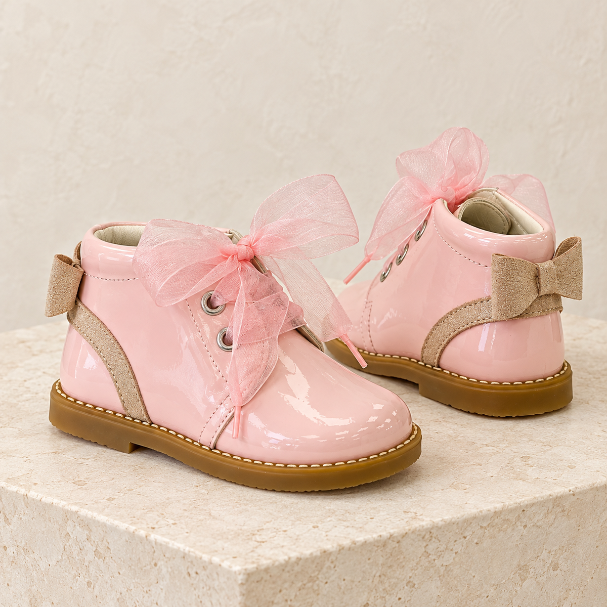 Andanines pink patent leather girls bow ankle boots with tulle laces and gold heel bows