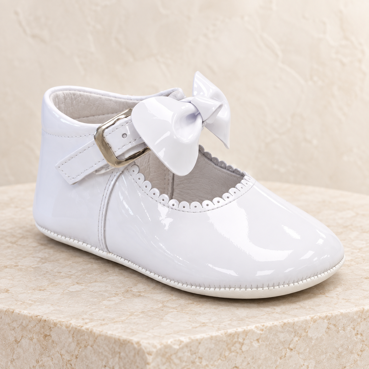 Andanines white patent leather baby girls bow pram shoes