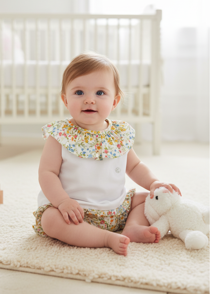 Baby girl wearing floral outfit in elegant setting
