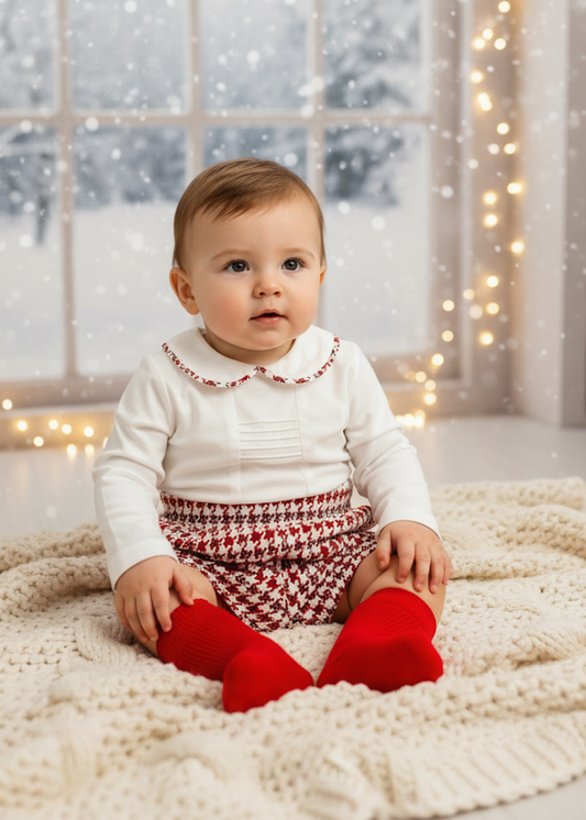 Basmarti boys red dogtooth short set in a winter setting