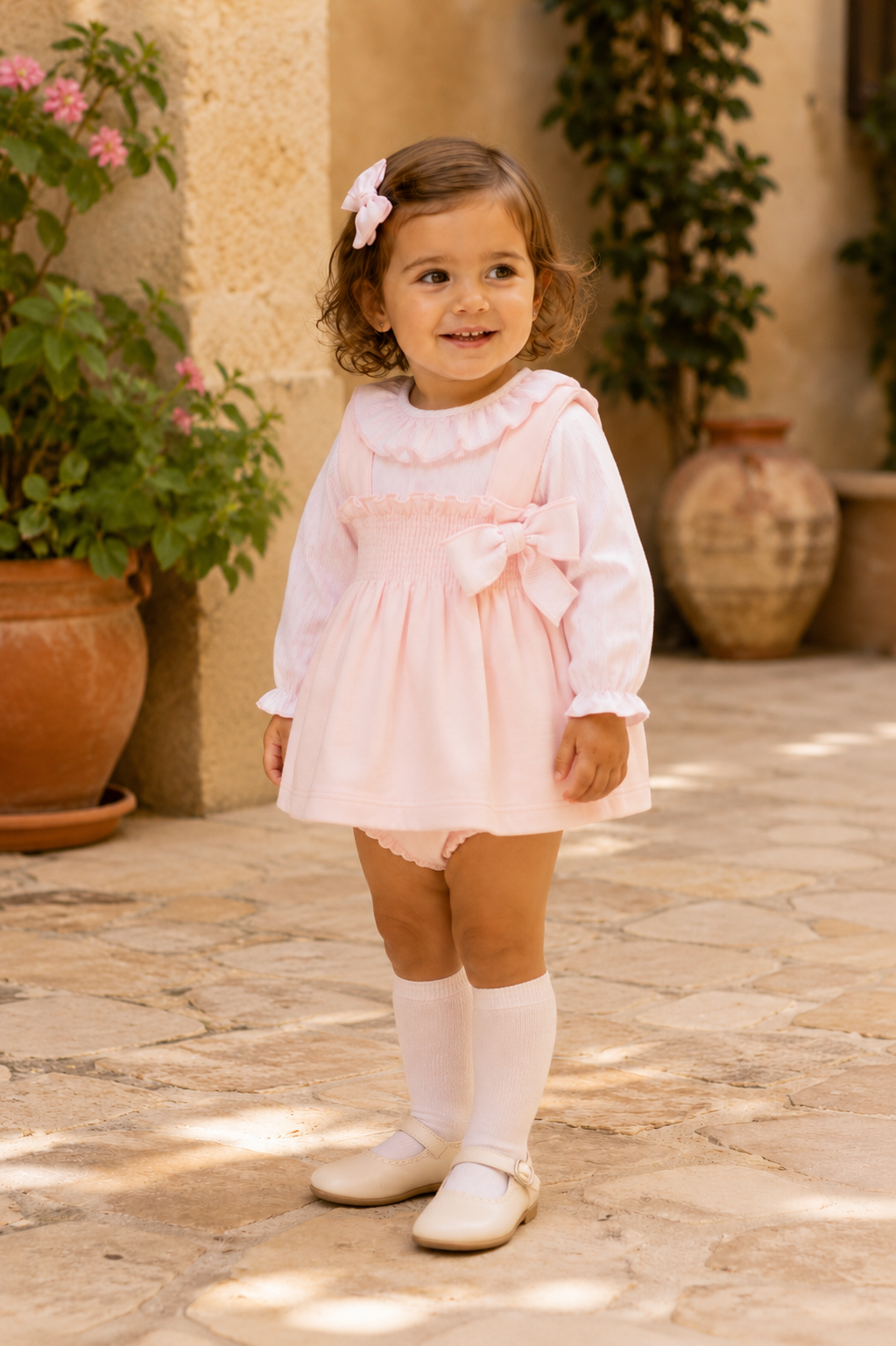 Calamaro Lebeche pink dress and knickers set with side bow three-quarter view