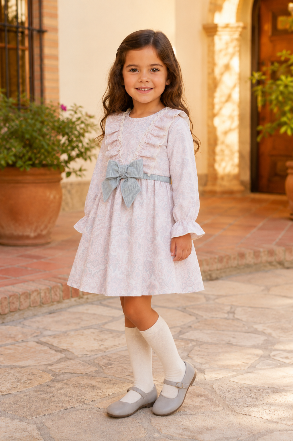 Calamaro Turia pink paisley dress with vertical ruffles three-quarter view