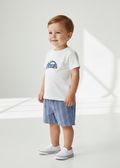 Car t-shirt and striped shorts on a toddler boy