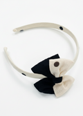 Cream and black headband plain background