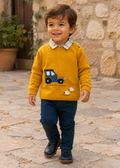 Boy wearing Mayoral mustard tractor jumper, checked shirt and navy trousers