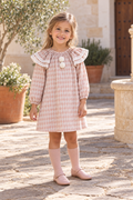Girl wearing the Foque Circo pink harlequin dress in Spain