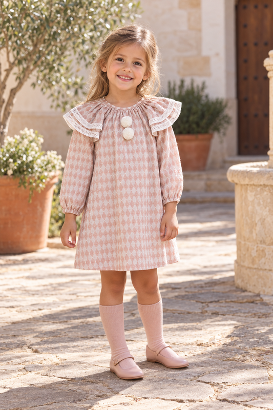 Girl wearing the Foque Circo pink harlequin dress in Spain